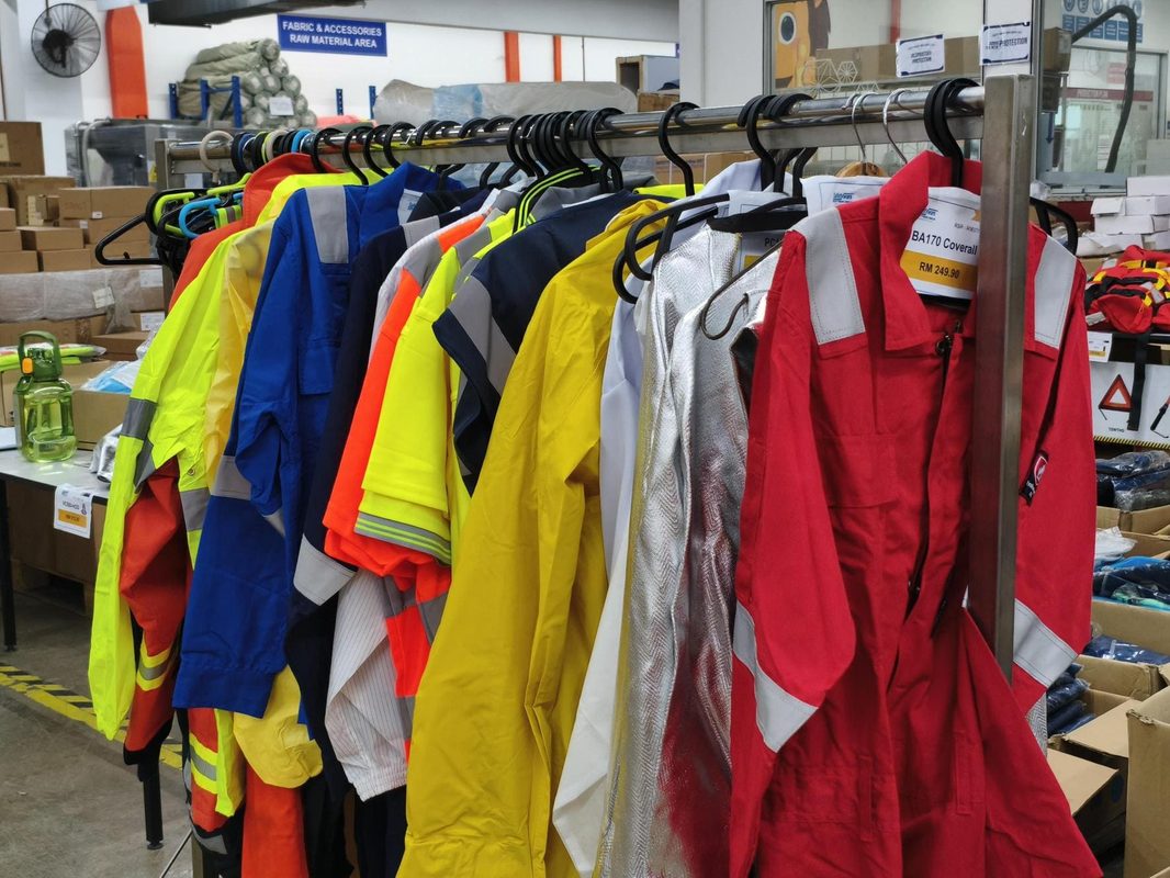 Reflective workwear and coveralls displayed at the Safetyware Warehouse Sale