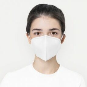Woman in basic white mask  for COVID-19 protection campaign